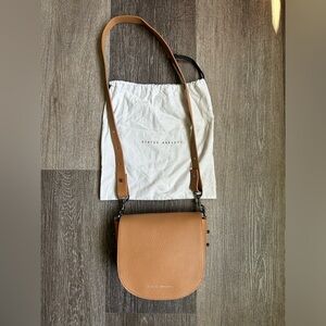 Status Anxiety “Art of Pretending” Tan Leather Crossbody Bag
